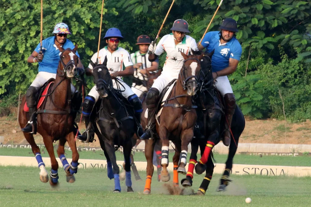 Polo players skillfully competing on the field, showcasing their agility and teamwork during an intense match