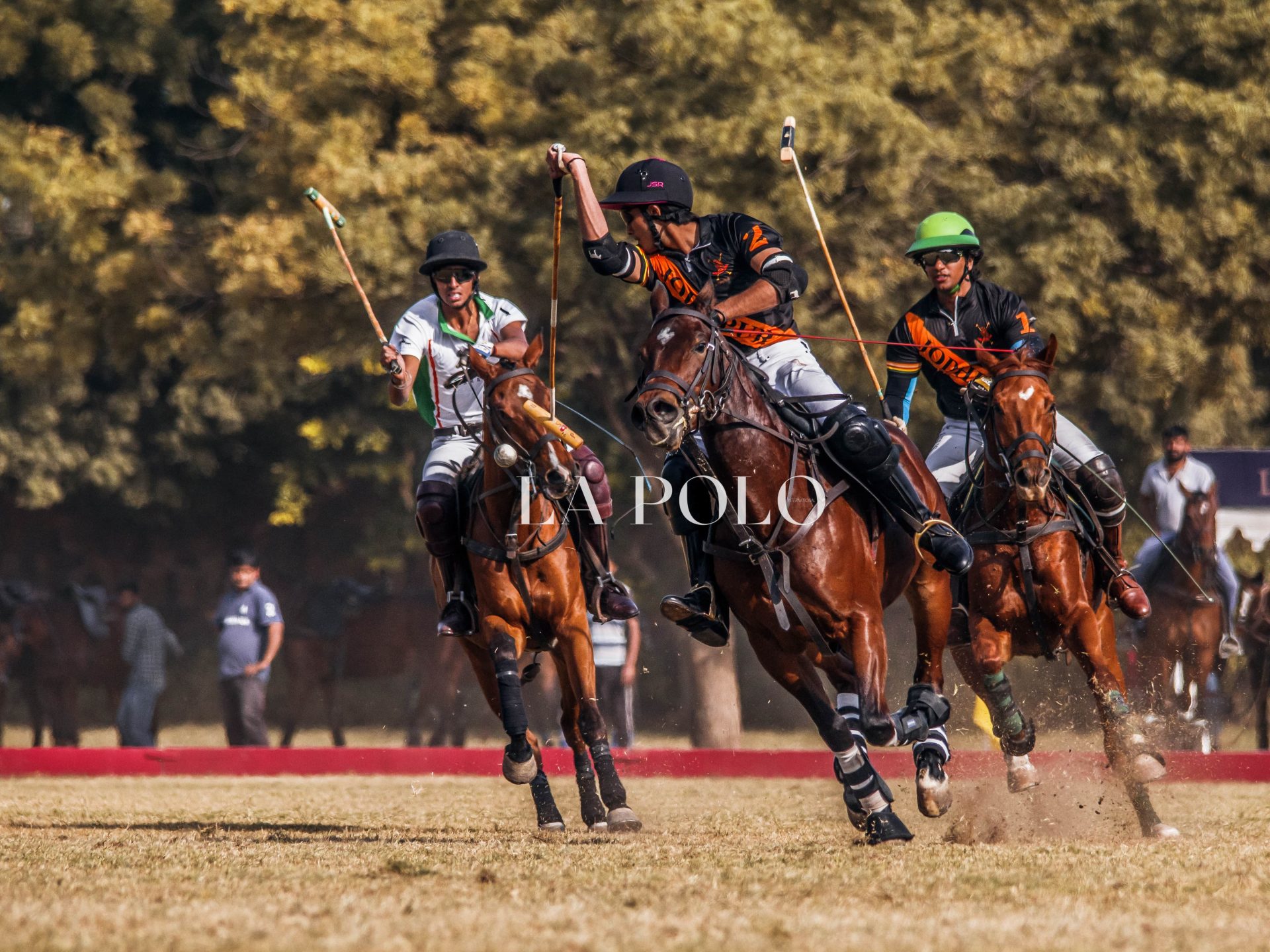 Polo players skillfully competing in a dynamic match, showcasing their athleticism and teamwork on the field.
